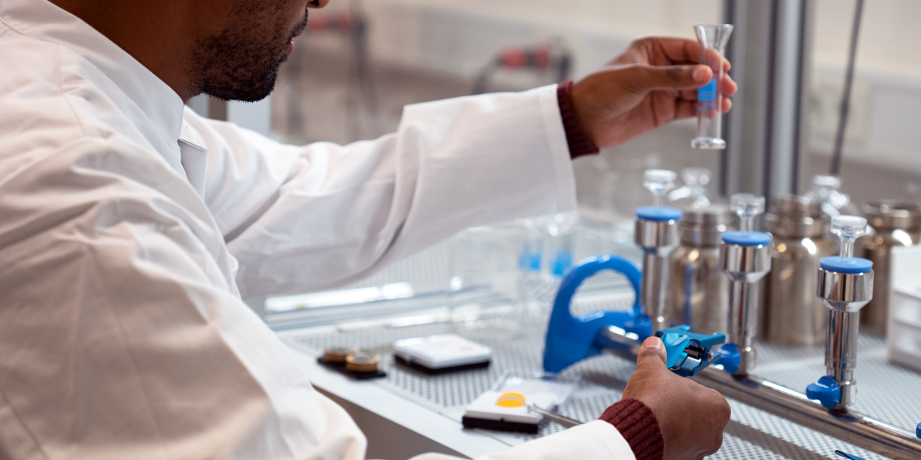 A laboratory employee prepares samples for microplastic analysis.